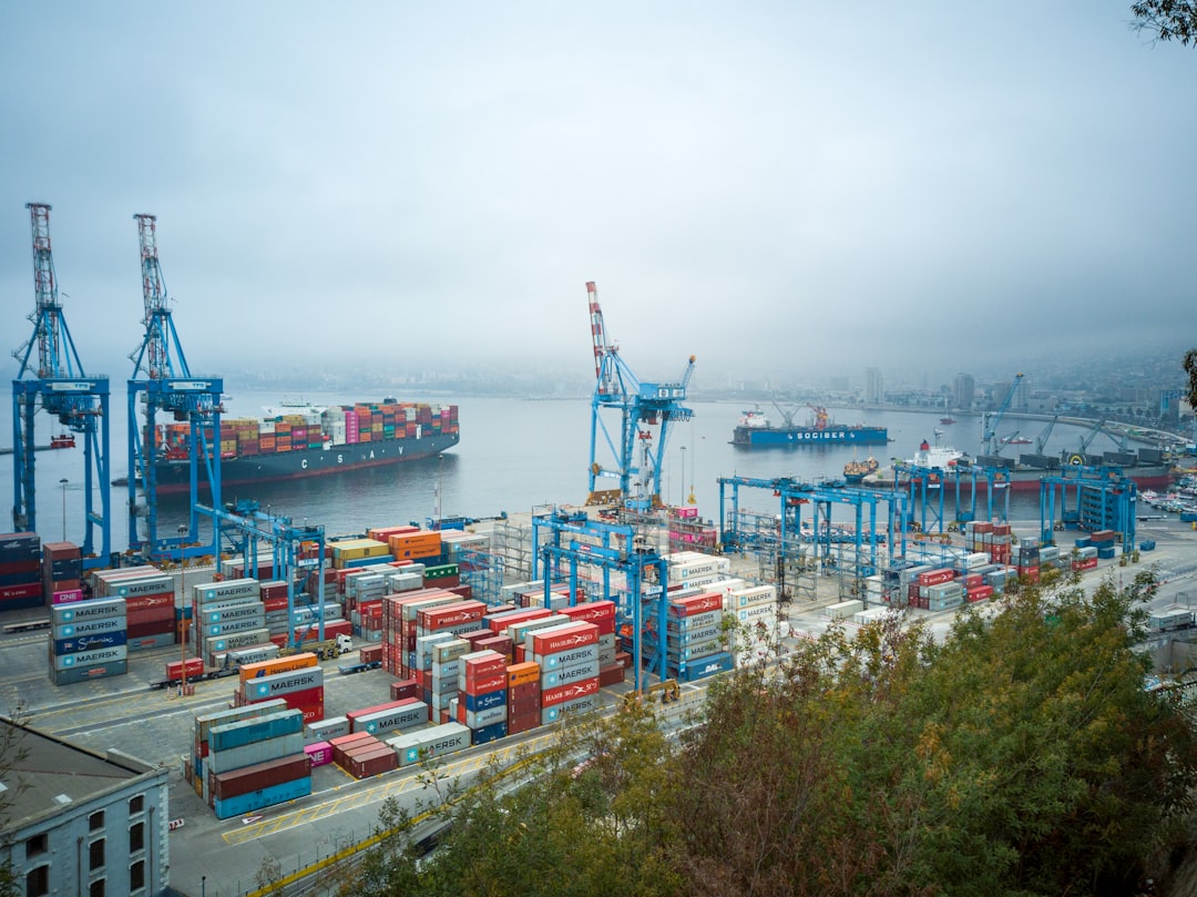 Shipping containers stacked at a port, representing Asian and specialty food importer insurance