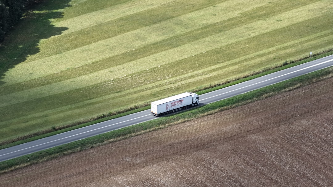 Semi-trucks hauling freight on an interstate highway for commercial trucking insurance