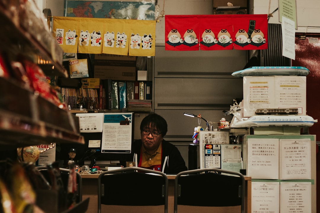 Clerk at a convenience store checkout counter, a common setting for insurance claims