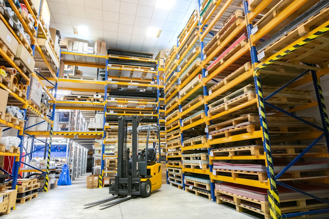 Forklift moving pallets inside a large food distribution warehouse facility