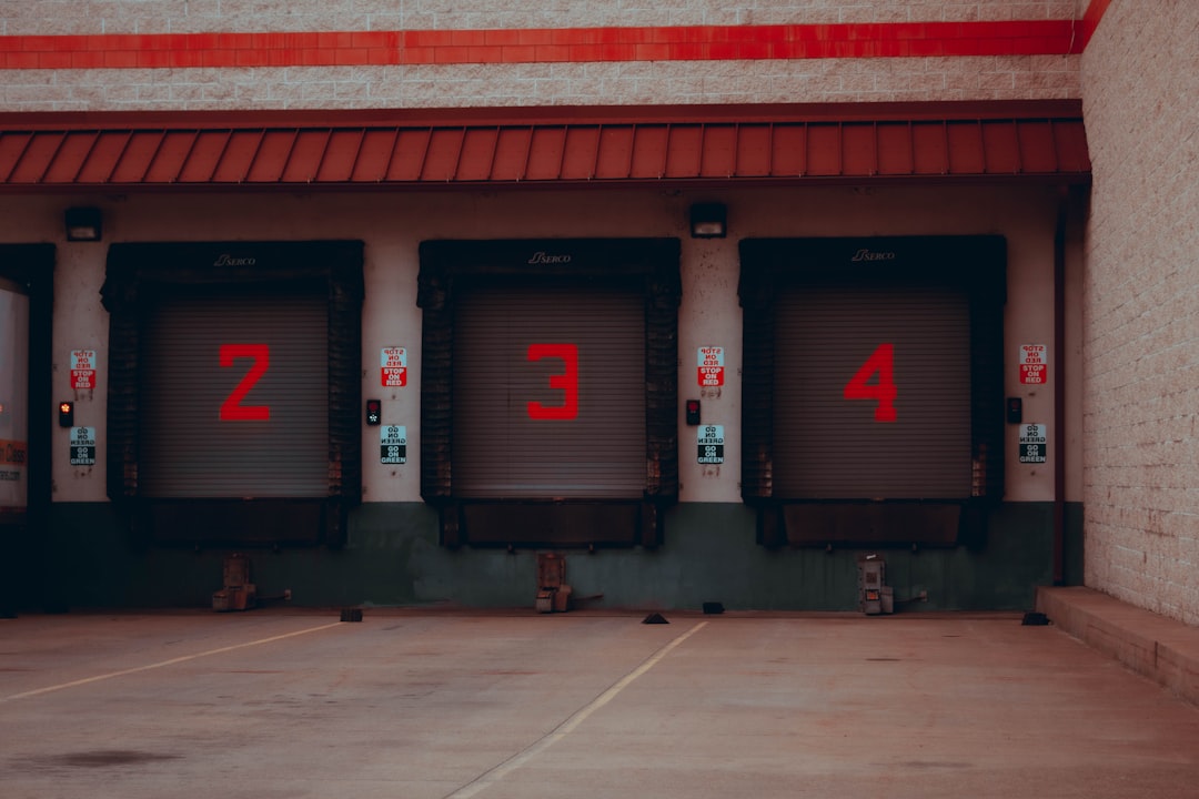 Commercial delivery trucks at a food distribution warehouse loading dock