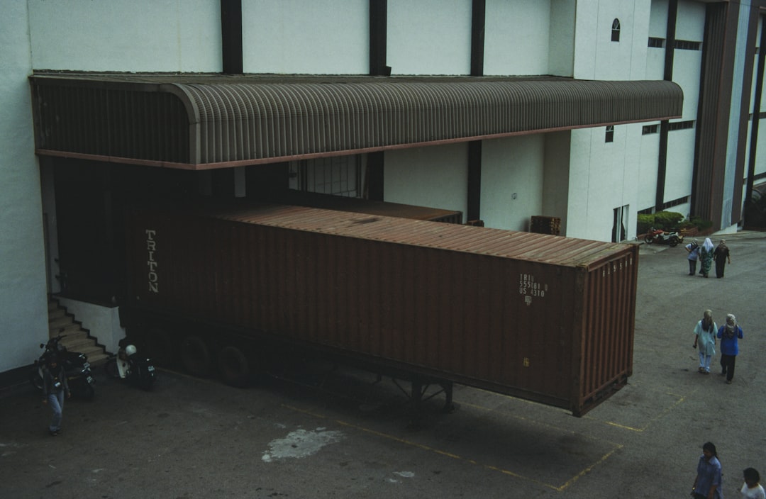 Warehouse workers loading food products at a distribution center loading dock